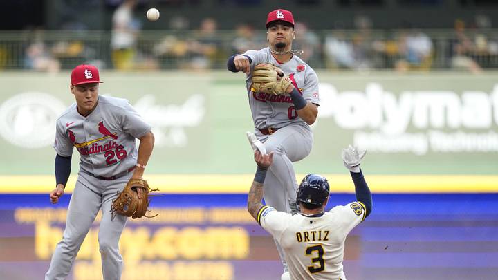 May 25, 2026; Milwaukee, Wisconsin, USA; St. Louis Cardinals shortstop Masyn Winn (0) attempts to turn a double play as Milwaukee Brewers shortstop Joey Ortiz (3) slides into second base during the fifth inning at American Family Field.