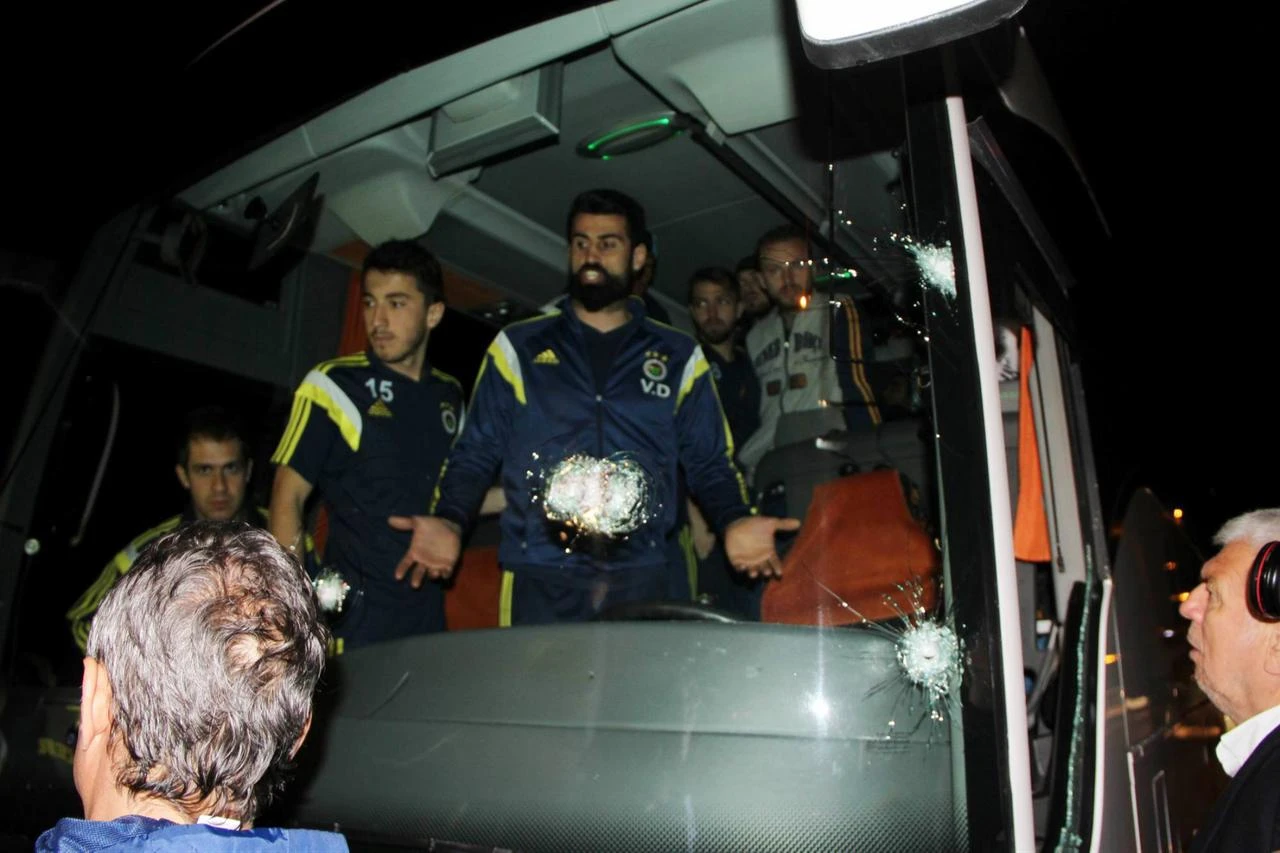 Fenerbahçe players stand inside their damaged team bus after gunfire struck the vehicle as it traveled through Trabzon province, April 4, 2015. (IHA Photo)