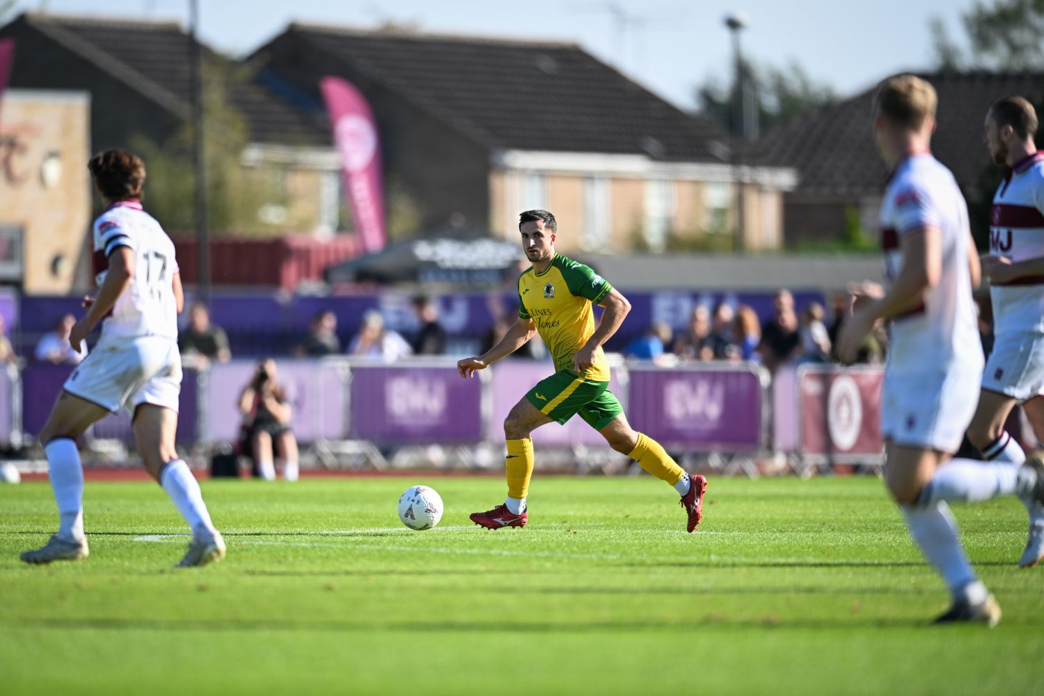 Horsham player in control of the ball