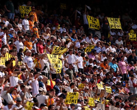 Valencia fans hold up signs that read: ‘Lim, go home’ in a protest against the clubs president, Kiat Lim, during La Liga match between Valencia and Barcelona